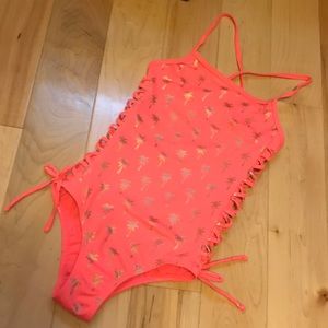Justice one piece swimsuit.  Coral/orange with gol